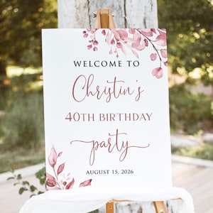 May include: Welcome to Christine's 40th Birthday party, a sign with watercolour floral design in shades of pink and burgundy, with the text "August 15, 2026".