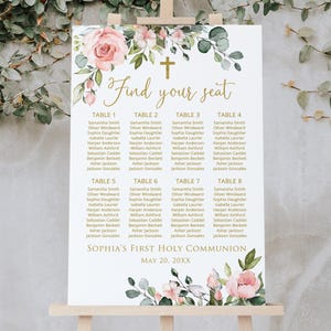 May include: A white seating chart for a First Holy Communion, with floral accents and a gold cross. The text "Find your seat" is in elegant script. Names are listed under table numbers 1-8. The date is May 20, 20XX.
