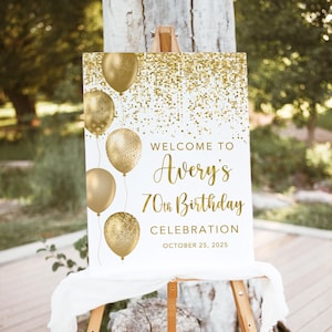 May include: Gold glitter welcome sign with gold balloons and the text "Welcome to Avery's 70th Birthday Celebration October 25, 2025".