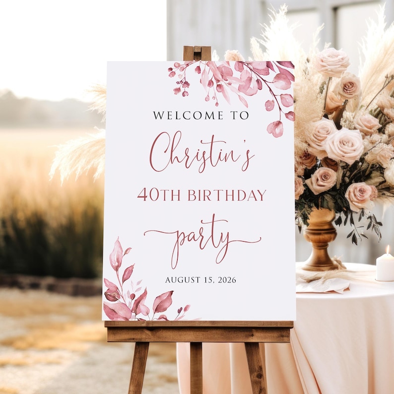 May include: Welcome to Christin's 40th Birthday party, 15 August 2026. A white sign with pink floral watercolour design and calligraphy text.