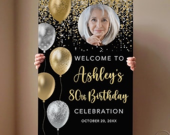 May include: A black birthday sign with gold and silver balloons, gold confetti, and a photo of a woman. The sign reads "Welcome to Ashley's 80th Birthday Celebration" with the date "October 20, 20XX".