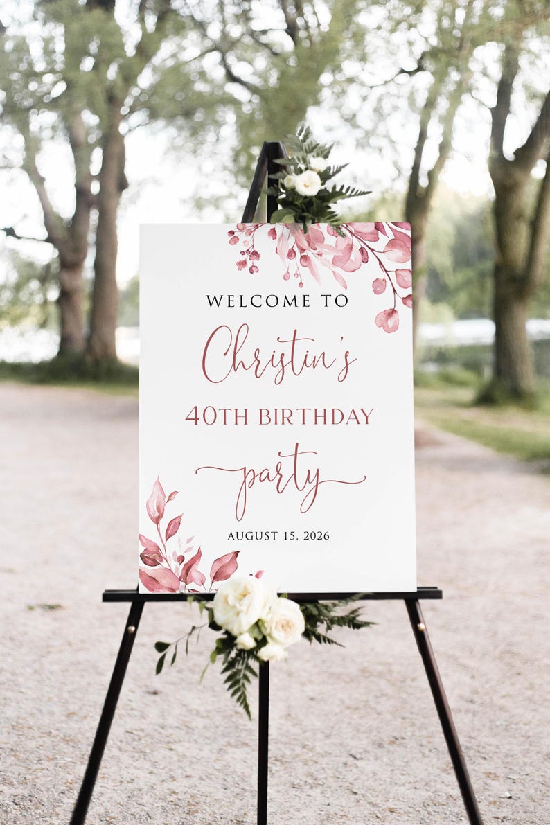 May include: Welcome to Christin's 40th Birthday party, 15 August 2026. A white sign with pink floral watercolour design and black calligraphy text.