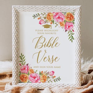 May include: White framed sign with a floral design in pink and yellow. The sign says "Please highlight your favorite Bible Verse and sign your name".