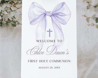 May include: A white welcome sign with a purple bow and a cross. The text reads "Welcome to Chloe Dawn's First Holy Communion August 20, 20XX".