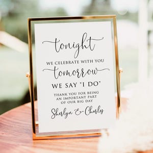 May include: A framed sign with gold trim and a white background. The sign reads "tonight, we celebrate with you, tomorrow we say 'I do', thank you for being an important part of our big day, Sherlyn & Charles."