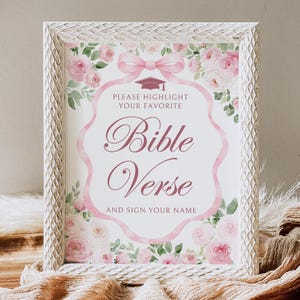 Może przedstawiać: Oprawiony znak z białą, teksturowaną ramą. Znak zawiera różowo-biały kwiatowy wzór ze słowami "Bible Verse" w eleganckim skrypcie. Tekst "Please Highlight Your Favorite" i "And Sign Your Name" jest również dołączony.
