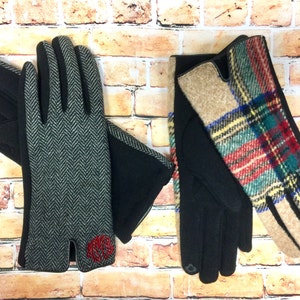 May include: Two pairs of gloves, one with a black and white herringbone pattern and a red monogram, and the other with a plaid pattern in red, green, blue, and yellow.
