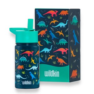 May include: A blue reusable water bottle with a green lid and a straw. The bottle has a colorful dinosaur pattern and the text "Wildkin" on it. The bottle comes in a matching box with a dinosaur pattern and the text "Wildkin" on it.