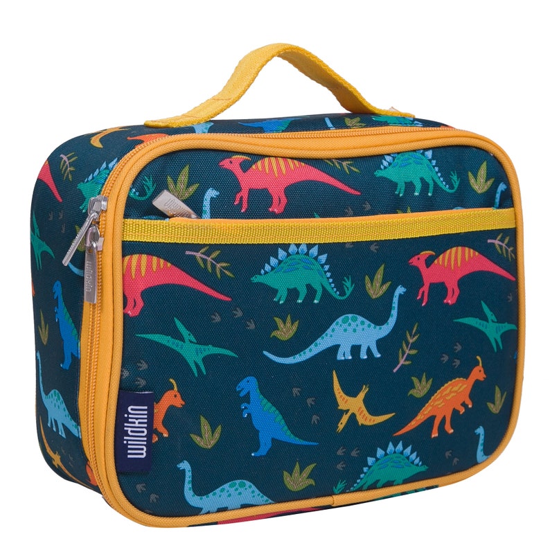 May include: A blue lunch bag with a dinosaur pattern. The bag has a yellow zipper and a yellow handle. The bag has the word "wildkin" printed on the side.
