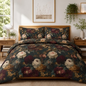 May include: A dark-toned duvet cover and two matching pillowcases featuring a dense, multi-colored floral print with large white, deep red, and golden yellow blossoms set against a dark green background, draped over a wooden bed frame.