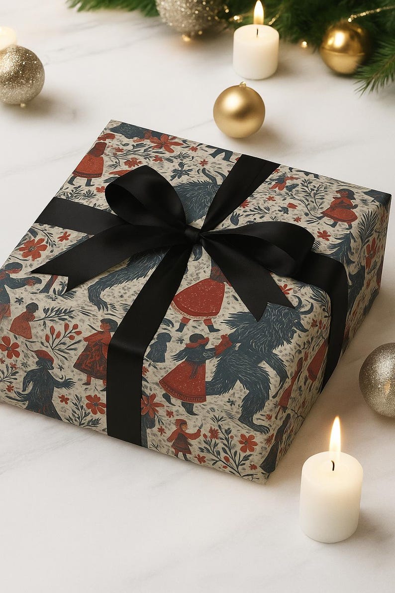 May include: A wrapped gift box with patterned paper featuring figures in red coats and blue creatures. The box is tied with a black satin ribbon and bow. Festive decorations, including candles and ornaments, surround the gift.