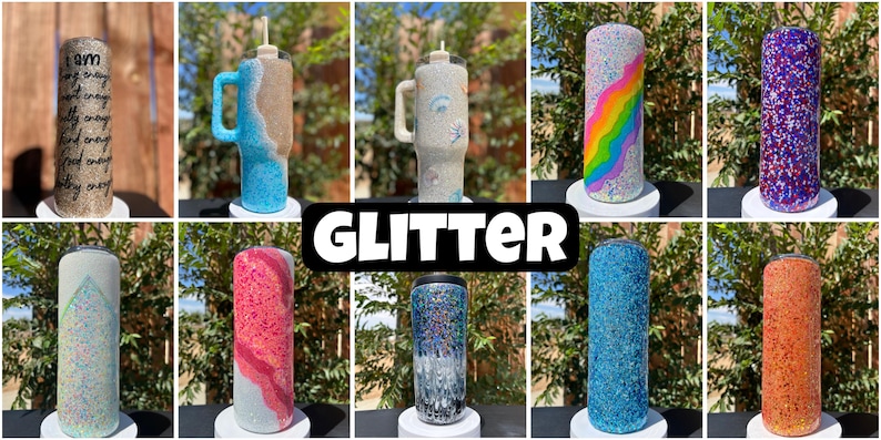 May include: A selection of glitter tumblers in diverse colours and designs. Some tumblers have text, others feature rainbow, beach, and abstract patterns. The tumblers are displayed on white stands against a natural background.