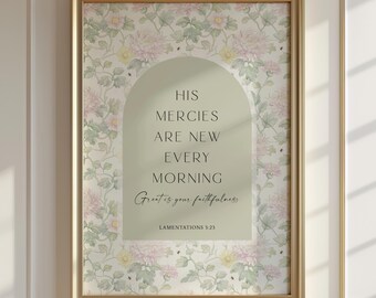 May include: A framed wall art print featuring a floral pattern with pink and yellow flowers on a light background. A sage green arch in the centre contains the black text: HIS MERCIES ARE NEW EVERY MORNING, Great is your faithfulness, LAMENTATIONS 3:23.