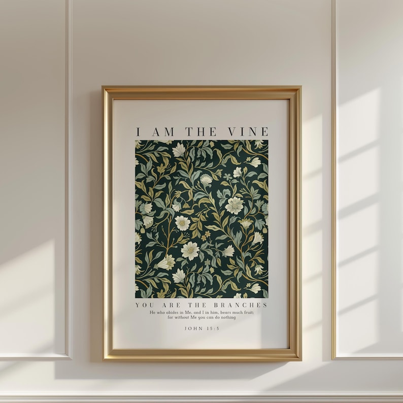 May include: A framed art print with a gold frame. The print features a dark green floral pattern with white and yellow flowers. The text "I AM THE VINE" is at the top, and "YOU ARE THE BRANCHES" and a Bible verse are at the bottom.