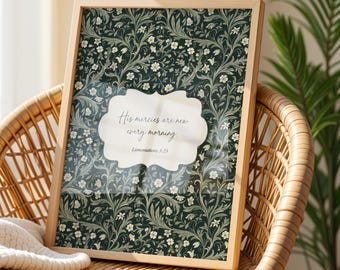 May include: A framed wall art print featuring a dark green background with a dense pattern of white flowers and swirling green vines. A central white scalloped label contains the black text: His mercies are new every morning. Lamentations 3:23.