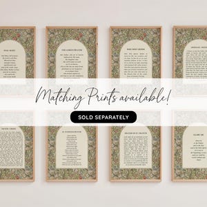 May include: Eight rectangular wall art prints in light wood frames, each featuring a central arch containing religious text against a detailed floral background with green leaves and red flowers. The text includes Hail Mary, The Lord's Prayer, and others.