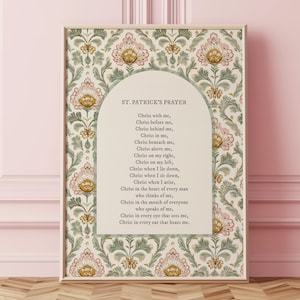 May include: A rectangular wall art print featuring a cream-colored central arch containing the text St. Patrick's Prayer. The background displays a repeating floral damask pattern in muted shades of sage green, dusty pink, and golden yellow.