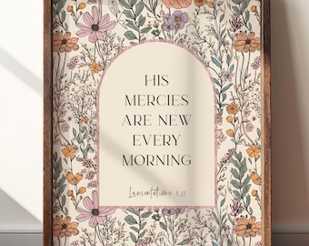 May include: A framed wall art print featuring a cream-colored arch containing the black text HIS MERCIES ARE NEW EVERY MORNING and Lamentations 3:23. The background is a repeating pattern of wildflowers in shades of pink, orange, and green.