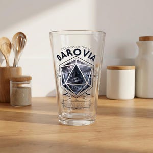 May include: A set of three ceramic mugs with a speckled, matte finish. The mugs are in shades of cream, light gray, and dark gray. Each mug has a simple, minimalist design, perfect for coffee or tea.