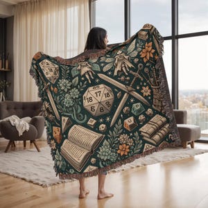 May include: A green and brown tapestry throw blanket with a dice, book, and floral design. The dice has the numbers 18, 17, 18, 4, 6, and 5 on it.