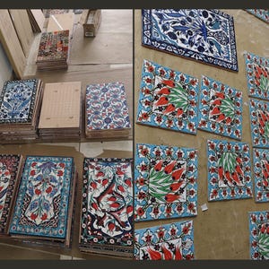 May include: Assortment of colorful ceramic tiles with floral patterns. The tiles are arranged in rows on a light blue surface. Some tiles feature a blue and white floral design, while others feature a red and green floral design.