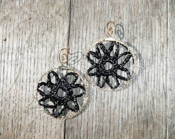 Black Marigold Unique flower crochet hoop earrings made out of upcycled plastic thread and gold tone wire.