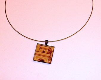 Minarete - Gunmetal square resin pendant on a dark blue wire featuring a tower drawing.