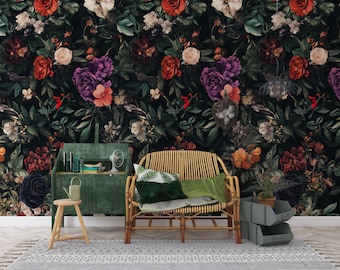 May include: A dark floral wallpaper featuring a variety of roses and other flowers in shades of red, purple, and white. A green desk, a wooden chair, and a woven bamboo chair are in front of the wallpaper.