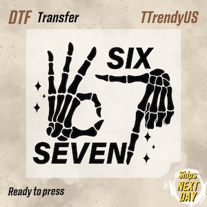 May include: Black and white DTF transfer design featuring skeleton hands spelling out "SIX" and "SEVEN". The design includes the text "Ready to press" and the seller's name "TTrendyUS".