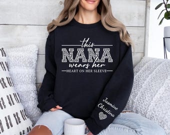 Custom This Nana Wears Her Heart On Her Sleeve Sweatshirt, Nana Heart Hoodie, Mother's Day Gift, Shirt with Names On Sleeve