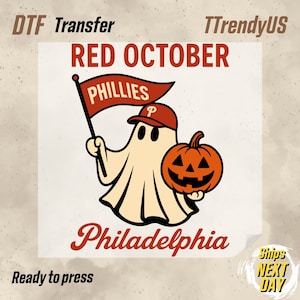 May include: DTF transfer featuring a ghost wearing a baseball cap and holding a flag that says "Phillies" and a jack-o'-lantern. The text "Red October" and "Philadelphia" are also included in the design.