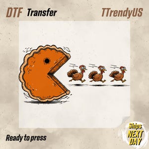 May include: DTF transfer featuring a Pac-Man-style pie chasing three turkeys. The pie is orange with a brown crust, and the turkeys are brown with red wattles. Text includes "DTF Transfer", "TTrendyUS", and "Ready to press".