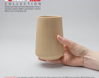 May include: A hand holds a light brown plaster mold for slip casting clay. The mold is shaped like a tall, cylindrical cup. The text "Concept RED" is visible in the image.