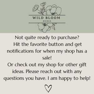 May include: An image featuring the text "WILD BLOOM WORKS" above a floral design. The text below encourages favouriting the shop for sale notifications and browsing for gift ideas. A heart symbol is at the bottom.