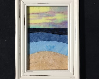 Mini Ocean Sunrise or Sunset in Batik Fabric Stitched & mounted in a white table top frame with stand shipping included