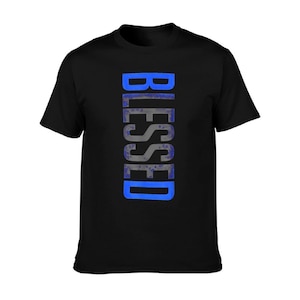 May include: Black t-shirt with the word "BLESSED" printed vertically in a blue and gray design. The shirt is a classic crew neck style.