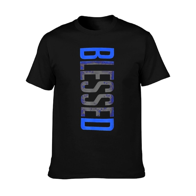 May include: Black t-shirt with the word "BLESSED" printed vertically in a blue and gray design. The shirt is a classic crew neck style.