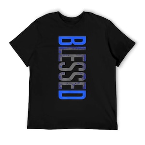 May include: Black t-shirt with the word "BLESSED" printed vertically in a blue and gray design. The text has a textured appearance, and the shirt is made of a soft material.