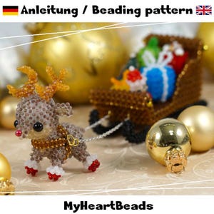 May include: A beaded reindeer figurine with gold antlers, a red nose, and white hooves, pulling a brown beaded sleigh filled with colourful gift boxes. The text "Anleitung / Beading pattern" and "MyHeartBeads" is visible in the image.