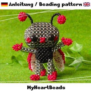 May include: A beaded insect figure with a silver body, black abdomen, and red accents. The figure has red beaded antennae, legs, and wings. The text "Anleitung / Beading pattern" is at the top, and "MyHeartBeads" is at the bottom.