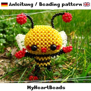 Peut inclure: Une figurine d'abeille perlée faite à la main, composée de perles jaunes, noires et rouges. L'abeille a des yeux noirs, des antennes et des ailes. Le texte "Anleitung / Beading pattern" et "MyHeartBeads" est inclus.