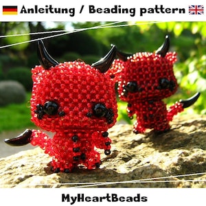 May include: Two small devil figurines crafted from red and black beads. Each figure features black horns, black eyes, and a black tail. The text 'Anleitung / Beading pattern' and 'MyHeartBeads' is visible at the top and bottom of the image.
