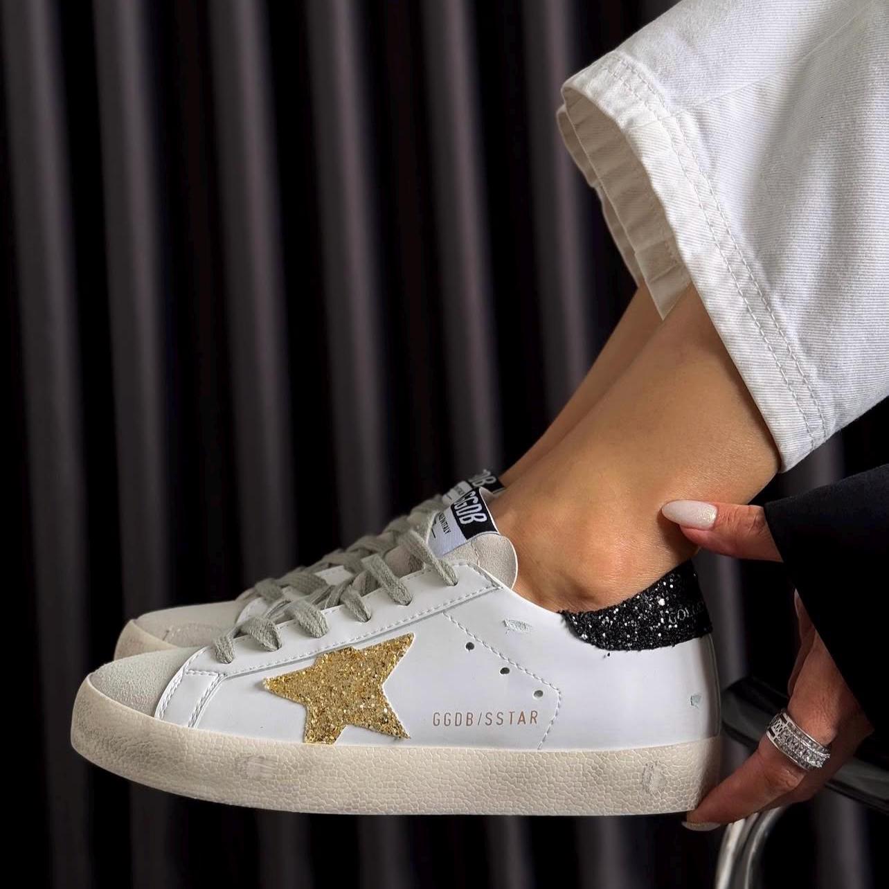 black and gold gym shoes