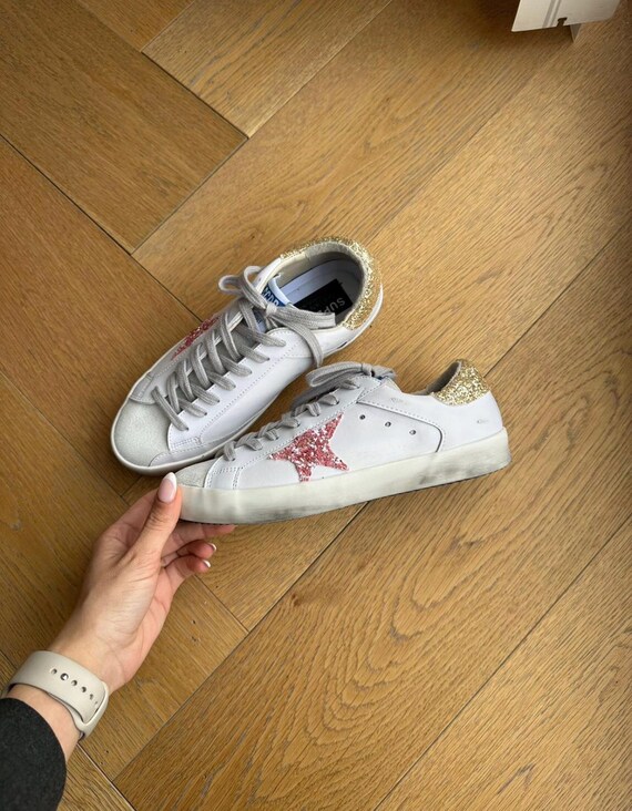 pink and gold golden goose
