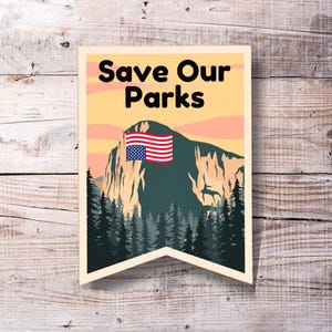 May include: A vintage-style poster with a mountain range and a US flag. The text on the poster reads "Save Our Parks".