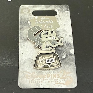 May include: Three Disney character pins on grey backing cards. Each pin shows a character with an inkwell, and the word "INK". The cards read "Disney Pins 25 Limited Edition". A collectible set for Disney fans.