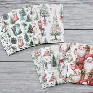 May include: A collection of rectangular paper cards featuring various Christmas-themed watercolour illustrations, including Santa Claus, snowmen, reindeer, pine trees, gift boxes, stockings, and holly berries in shades of red, green, and white.