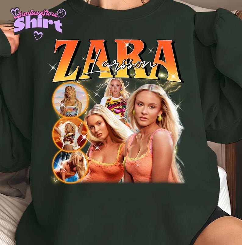 May include: Dark green sweatshirt featuring a graphic of Zara Larsson with the text "ZARA Larsson" in orange and white. The design includes multiple images of the singer, with a vintage aesthetic.