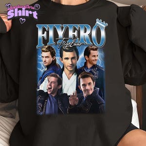 May include: Black sweatshirt with a graphic print of a group of men with the text "FYERO Tigelhaar" in blue and white. The men are wearing black and blue clothing and have a crown above the text.