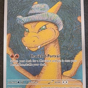 May include: A Charizard Pokémon card featuring a portrait of Charizard wearing a grey felt hat. The card has a HP of 250 and includes text describing the card's abilities and a fire symbol. The background is a textured blue and green.